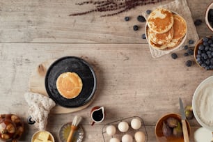 a table topped with pancakes and other foods