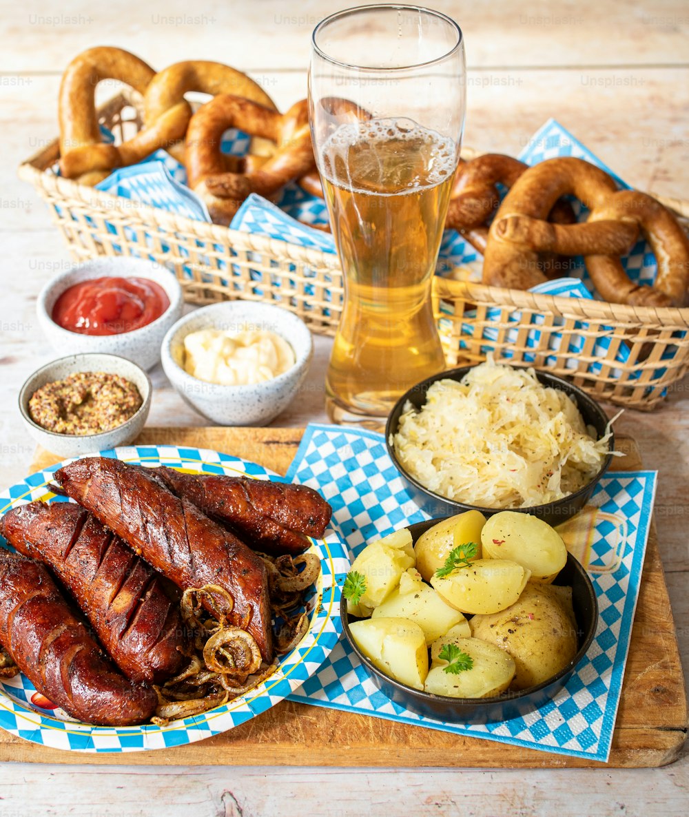 a wooden table topped with plates of food