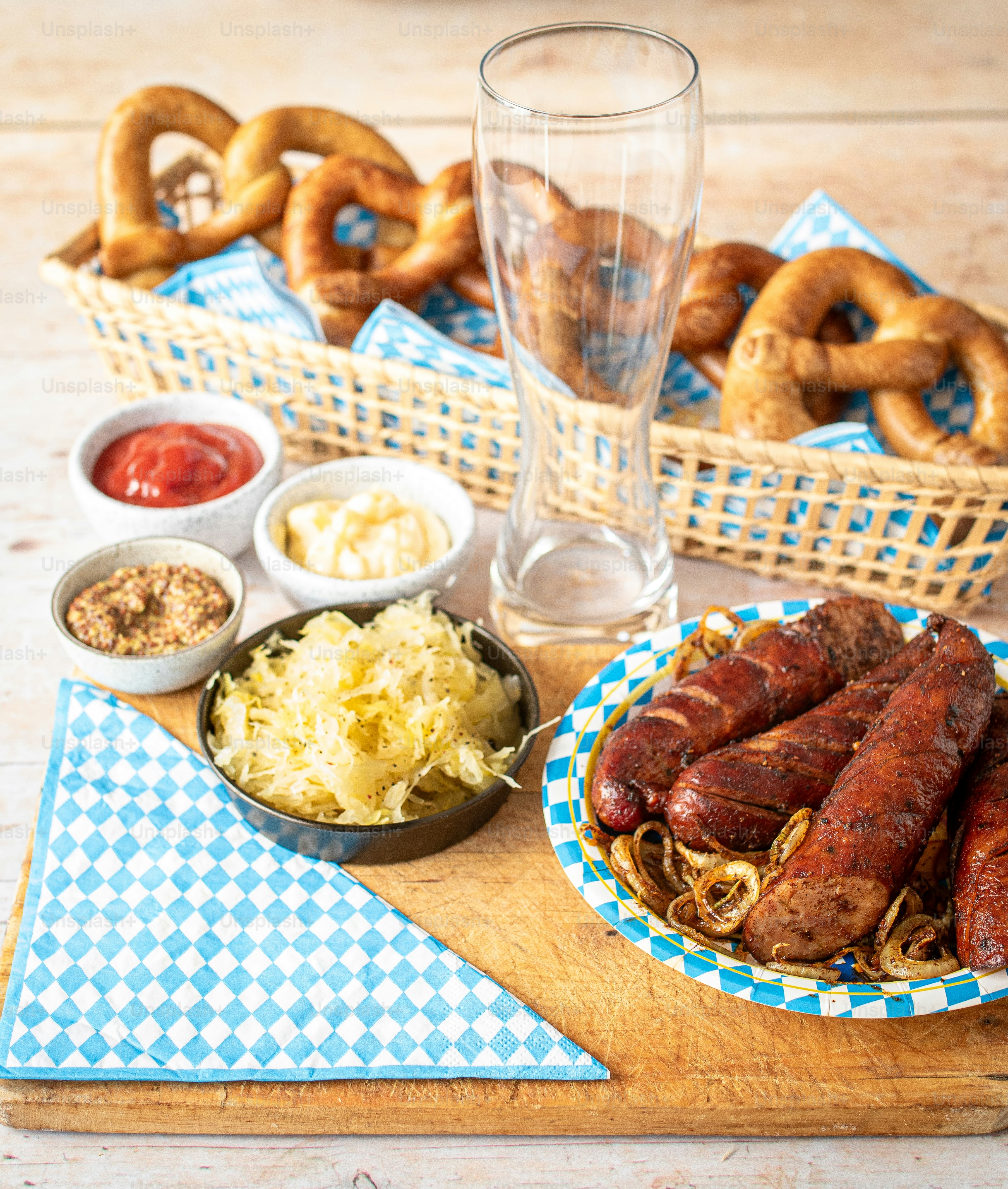a wooden table topped with plates of food