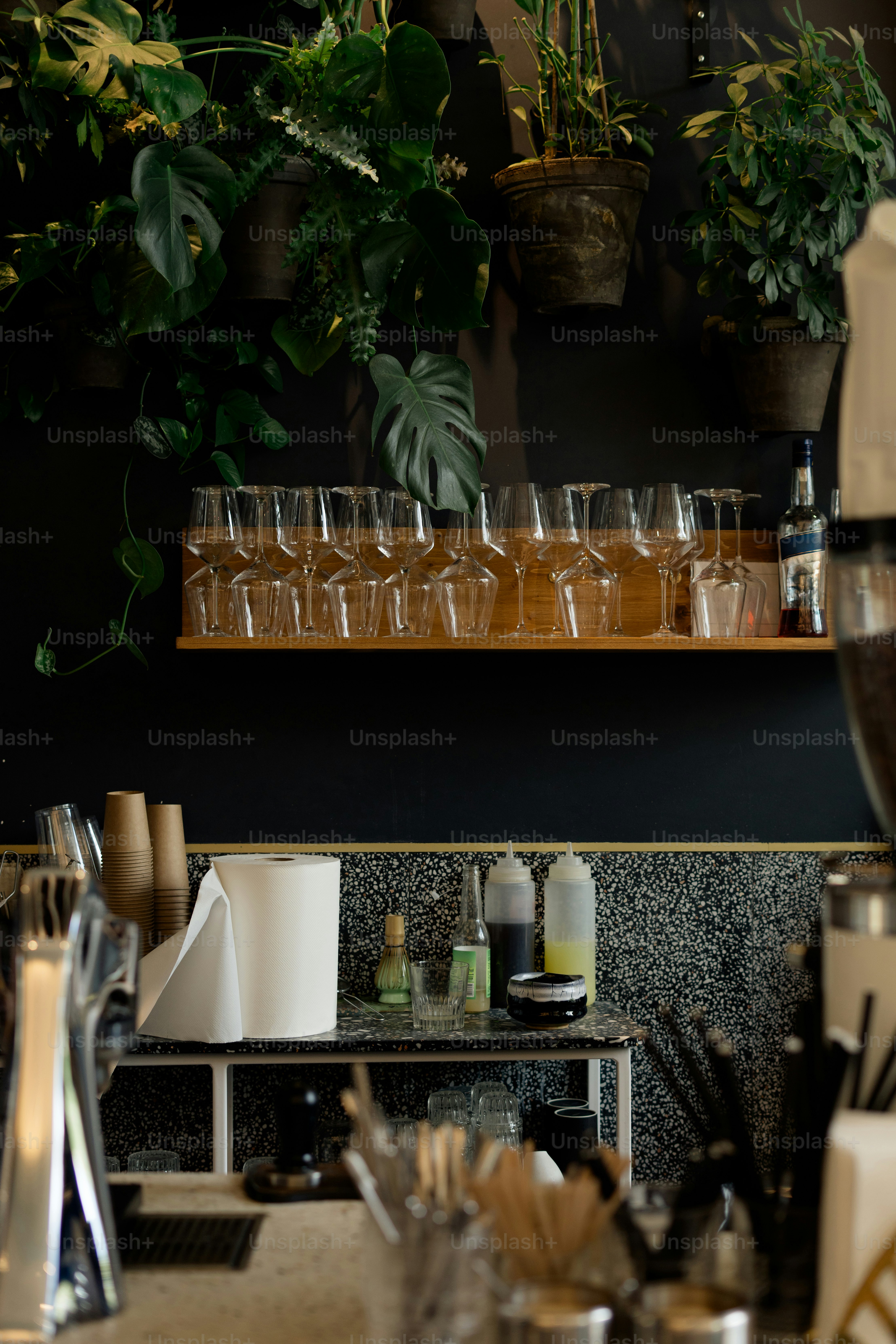a bunch of glasses are sitting on a shelf