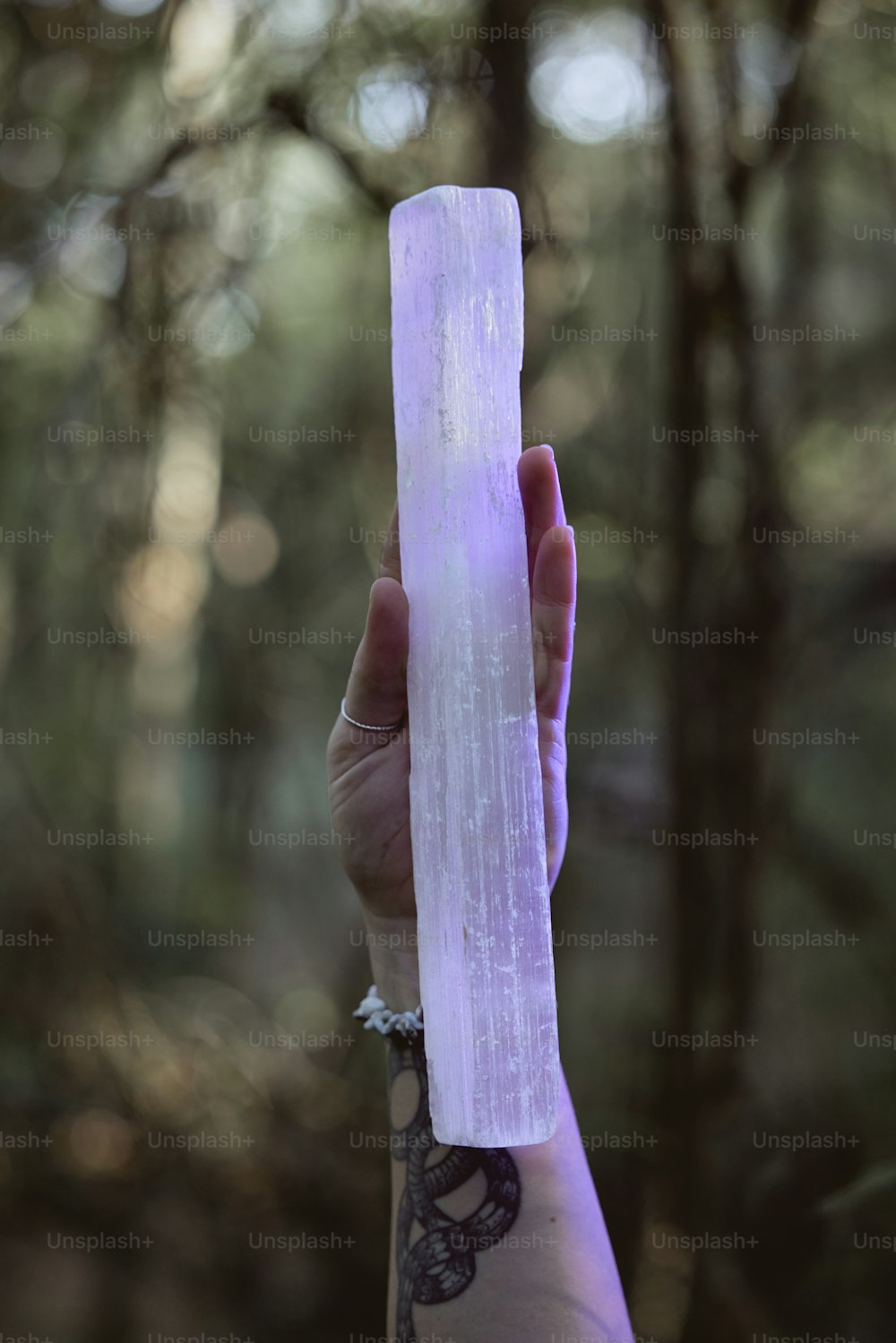 a person holding a large piece of ice in their hand