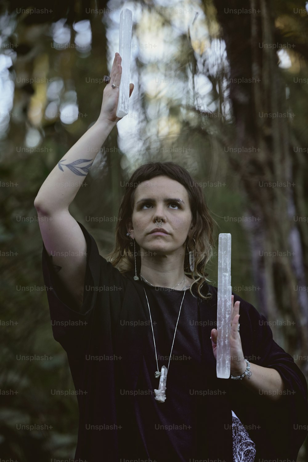 a woman holding a plastic bottle in the air