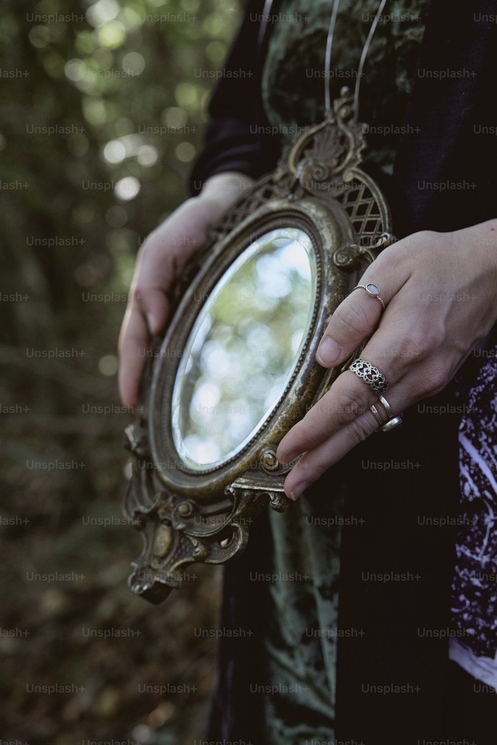 a woman holding a mirror in her hands