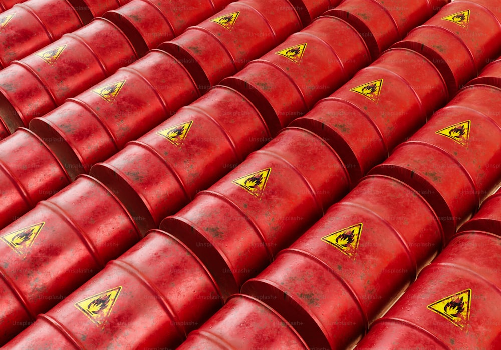 a large group of red barrels sitting next to each other