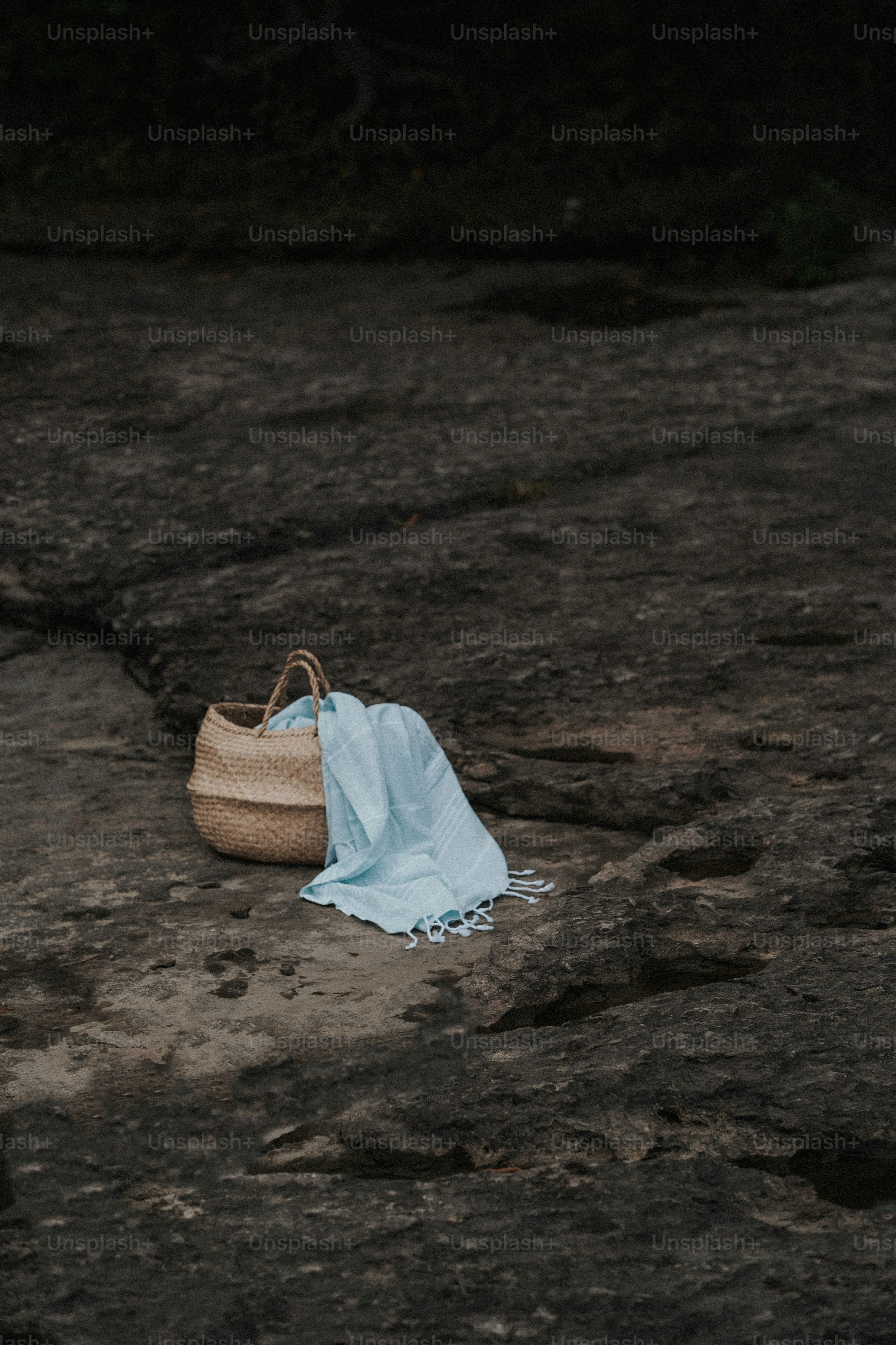 a pair of shoes sitting on top of a rock