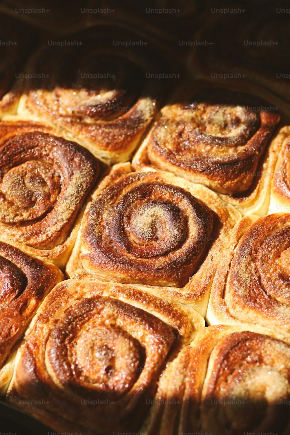 a pan filled with cinnamon rolls sitting on top of a table