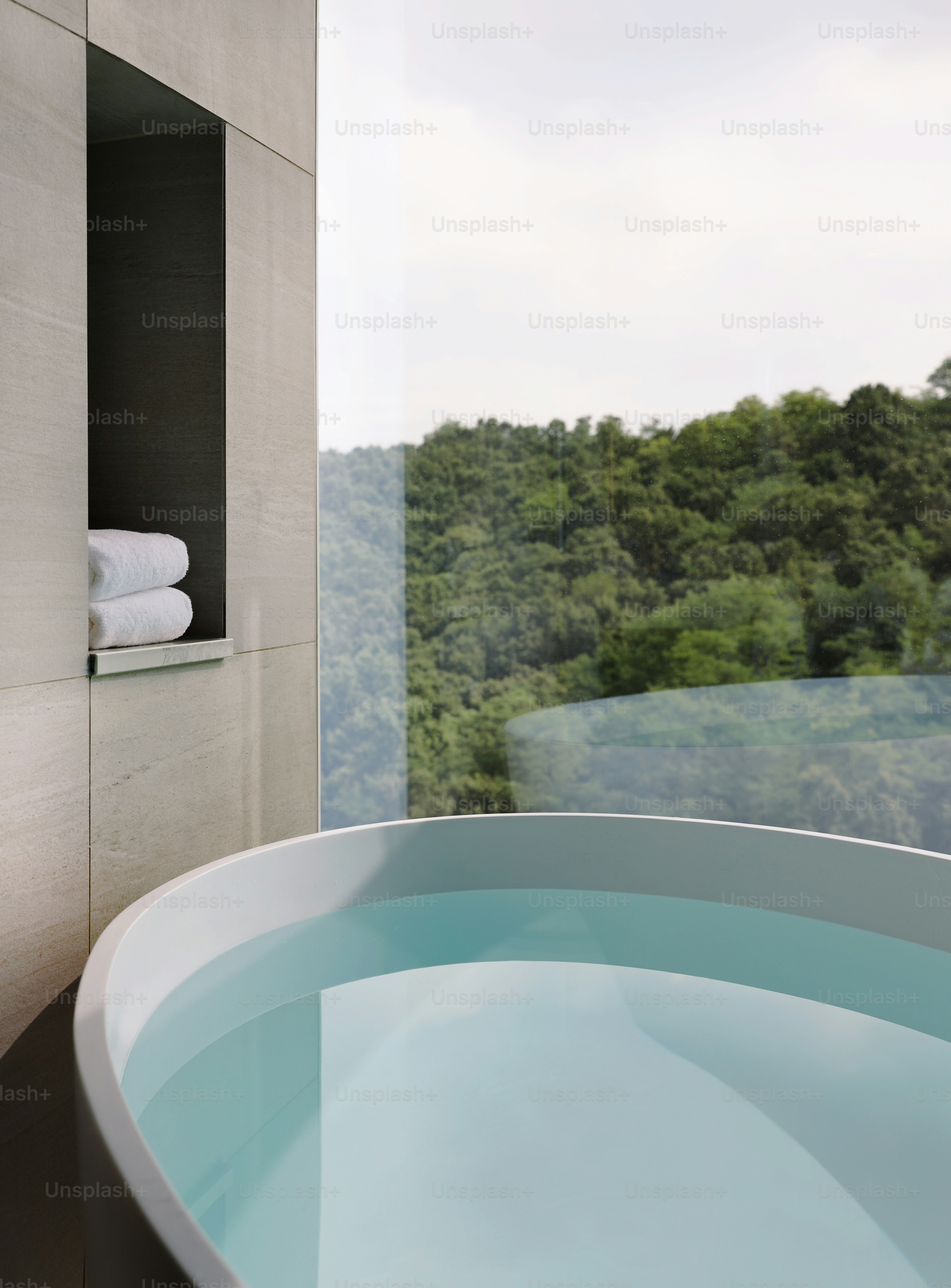 a bathroom with a large tub and a window