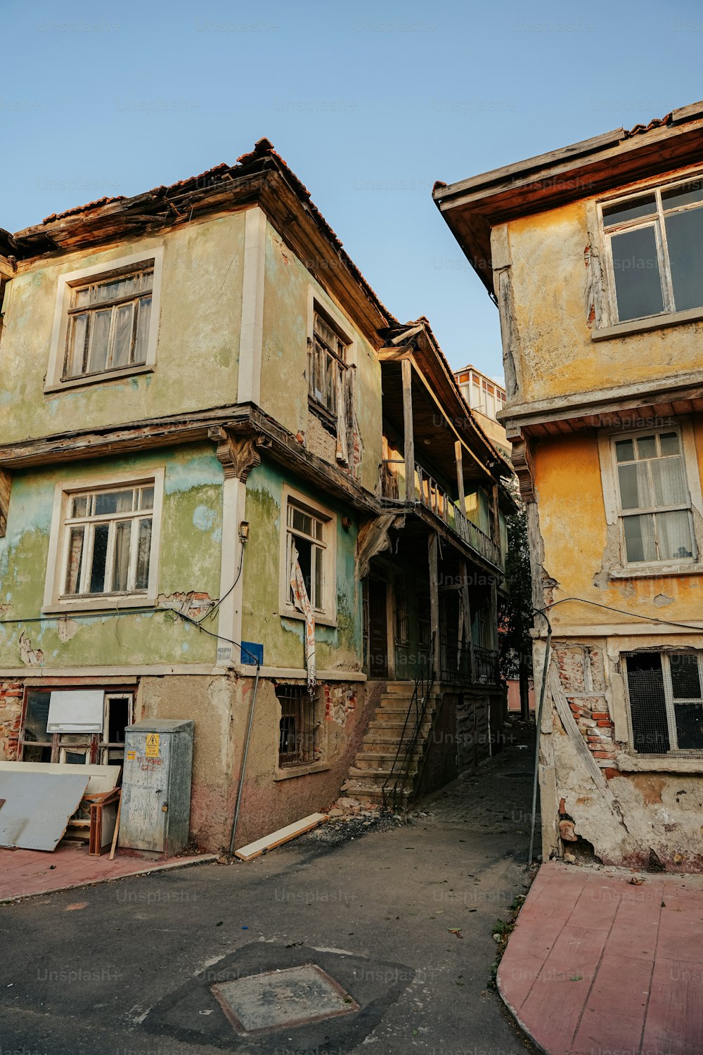 an old run down building with lots of windows