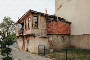 an old building with a satellite dish on top of it