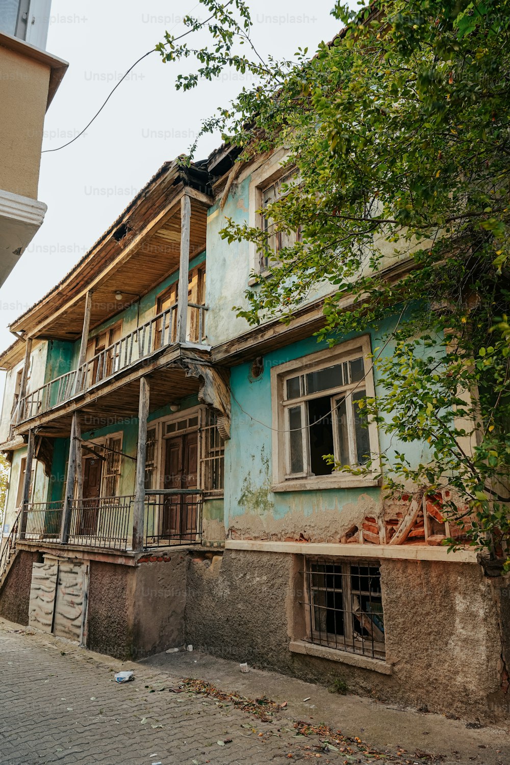 an old run down building with a balcony and balconies