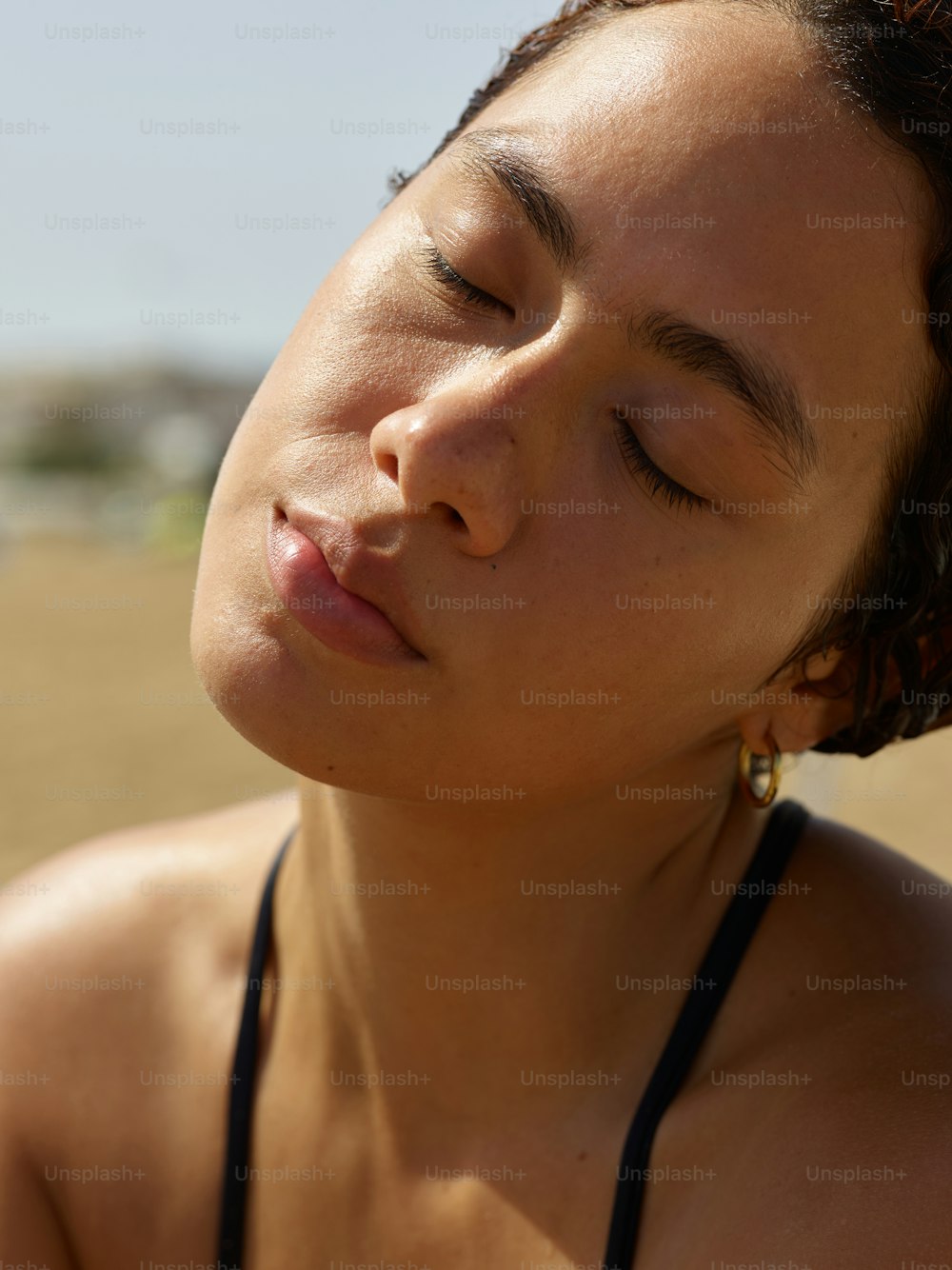 a close up of a woman with her eyes closed