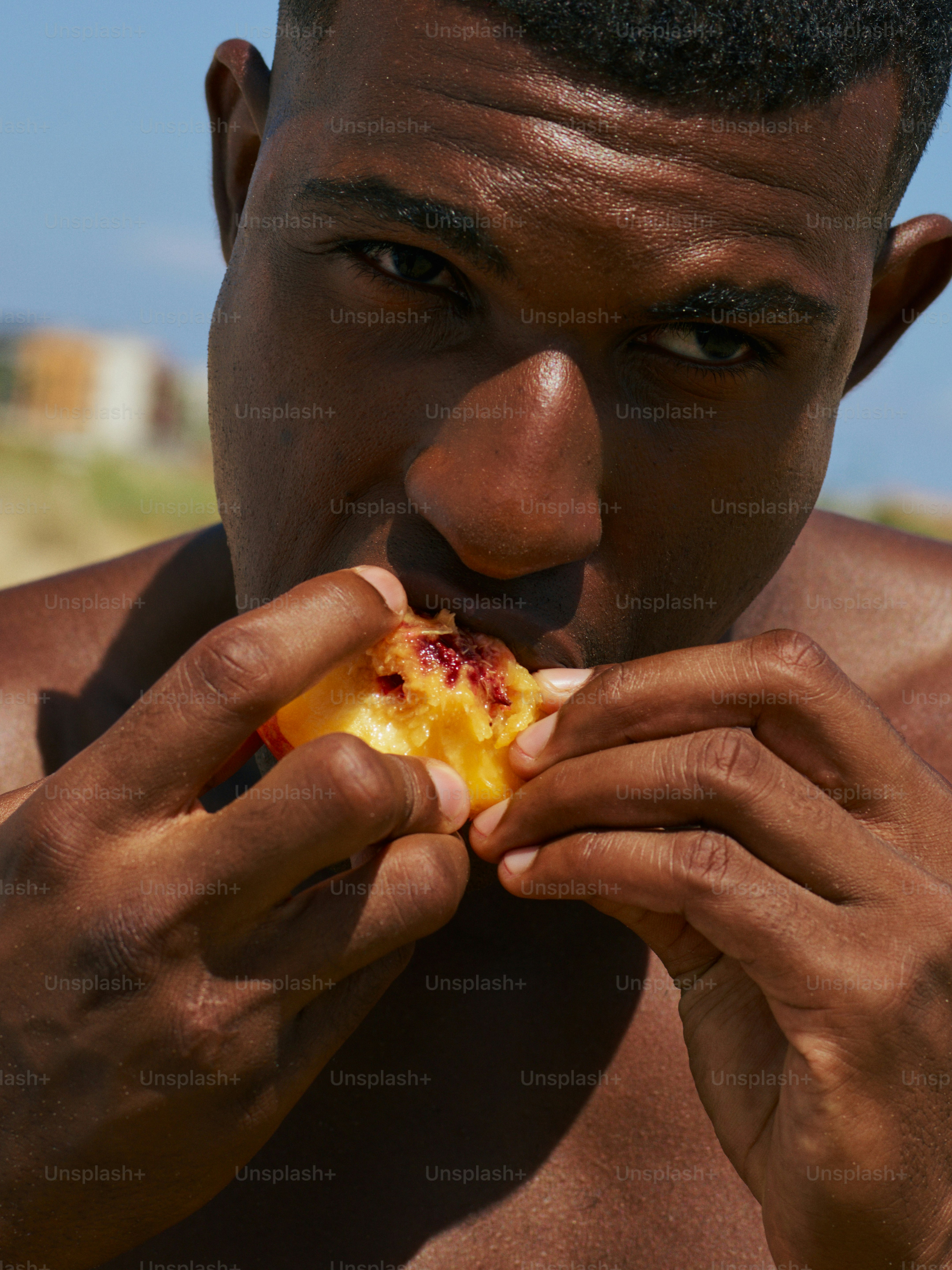 a man is eating a piece of food
