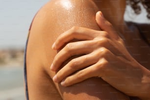 a close up of a woman's arm and shoulder