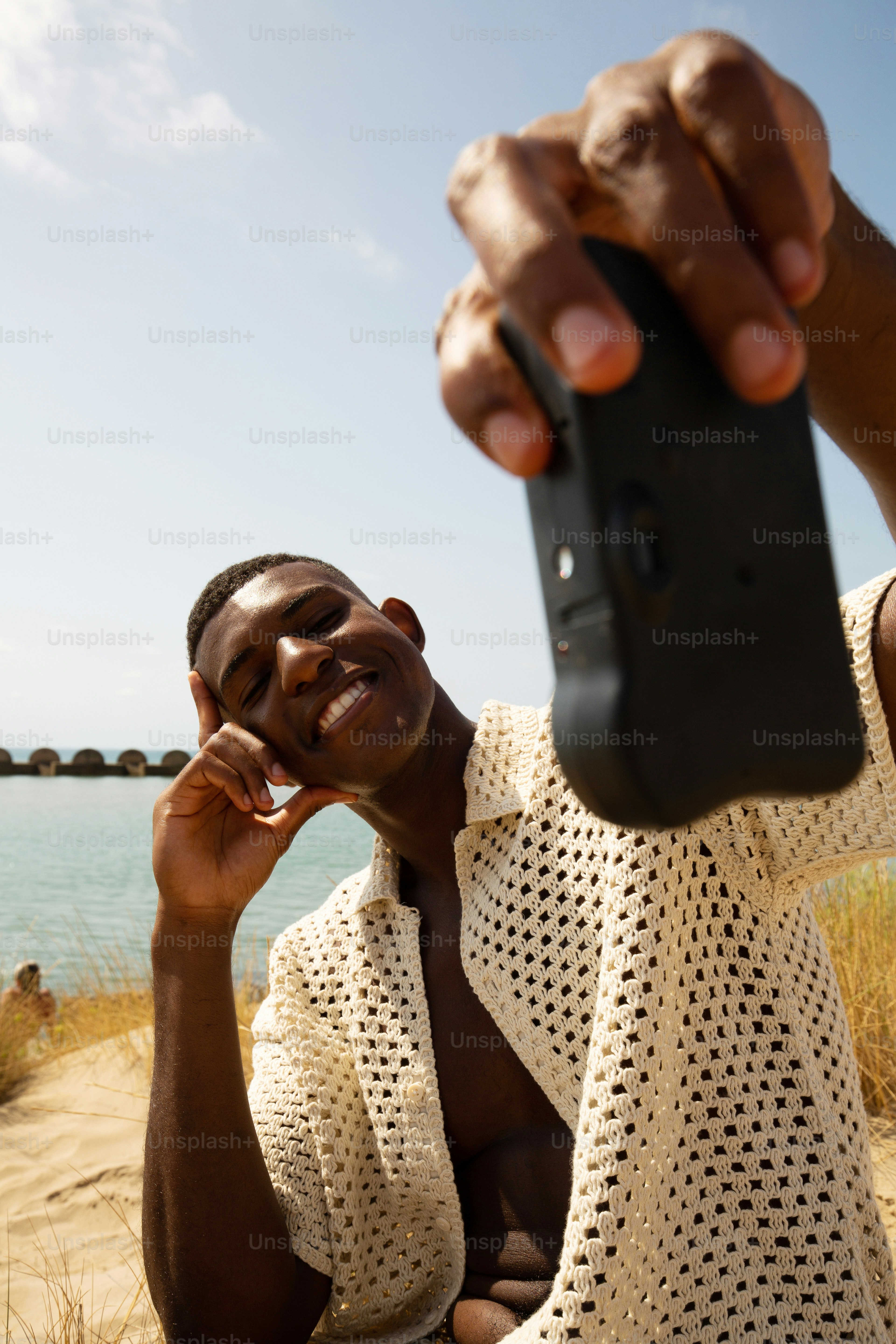 a man holding a cell phone up to his ear