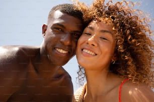 a man and a woman are posing for a picture