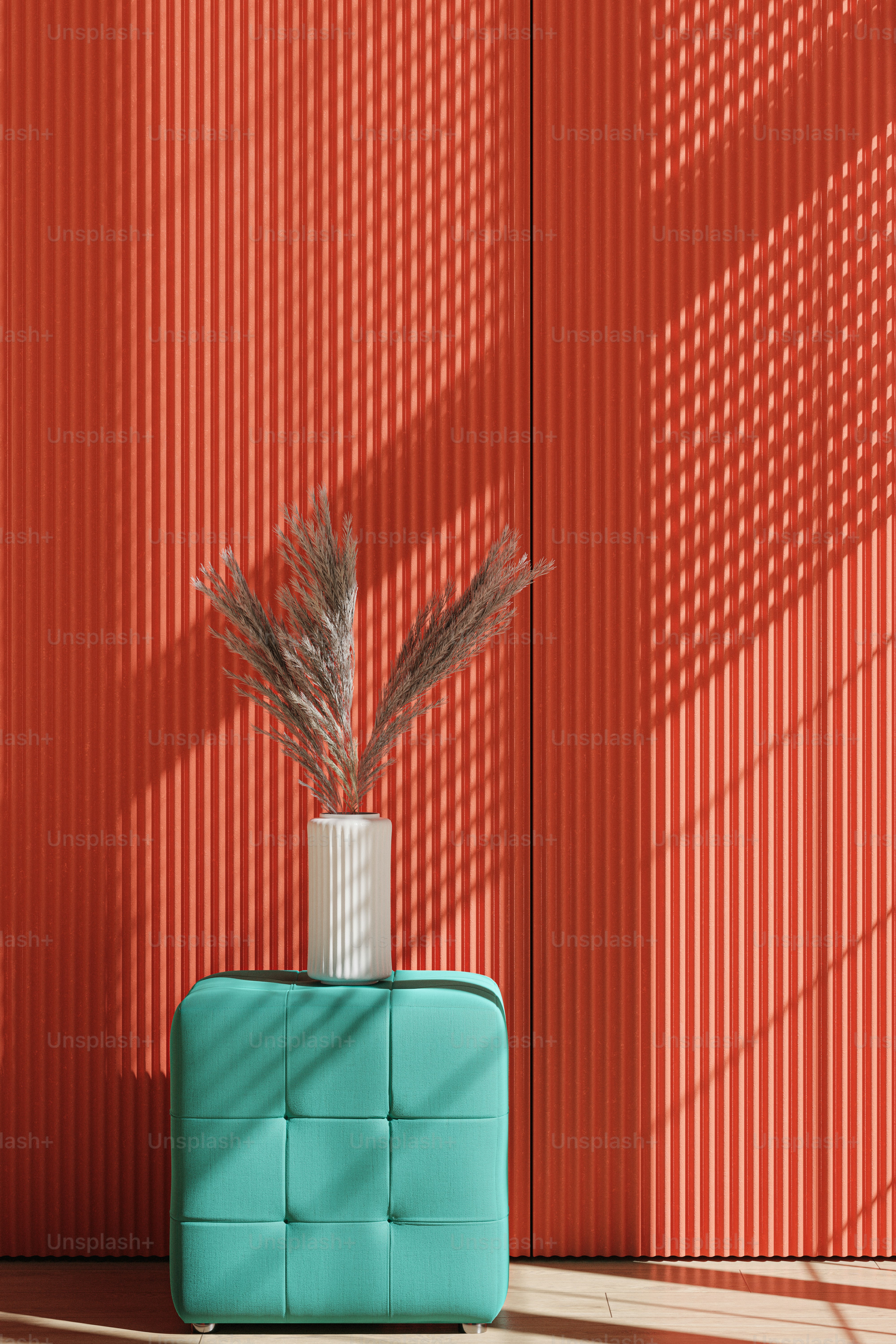 a vase with a plant in it sitting on a blue bench