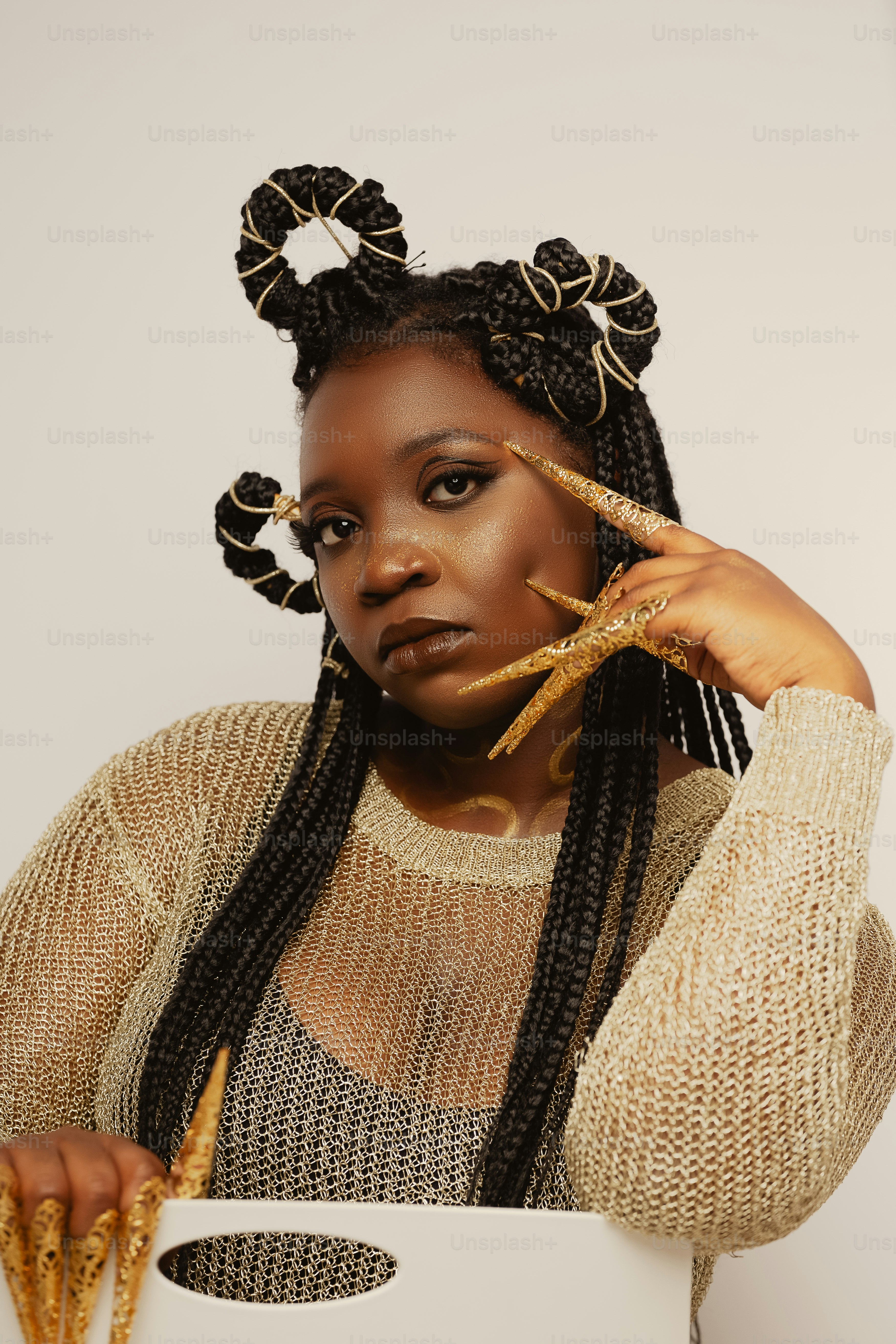a woman with long braids holding a piece of bread
