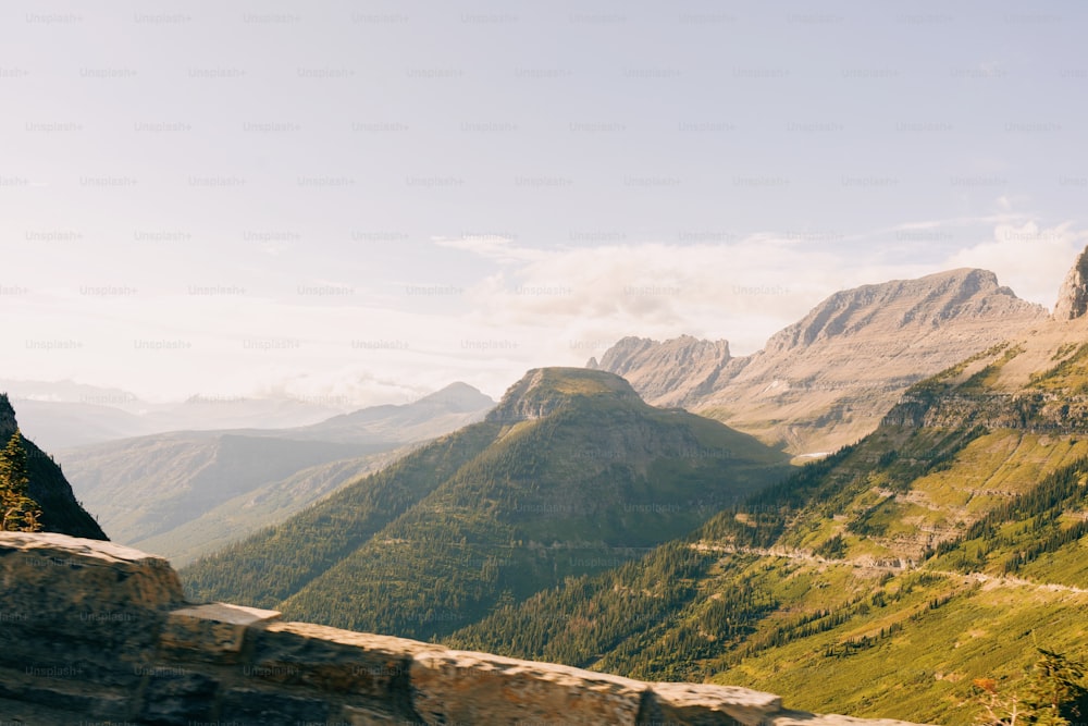 a scenic view of mountains and a road