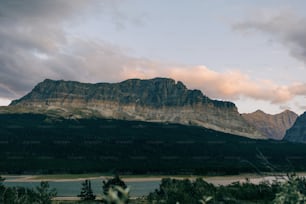 a mountain range with a body of water in the foreground