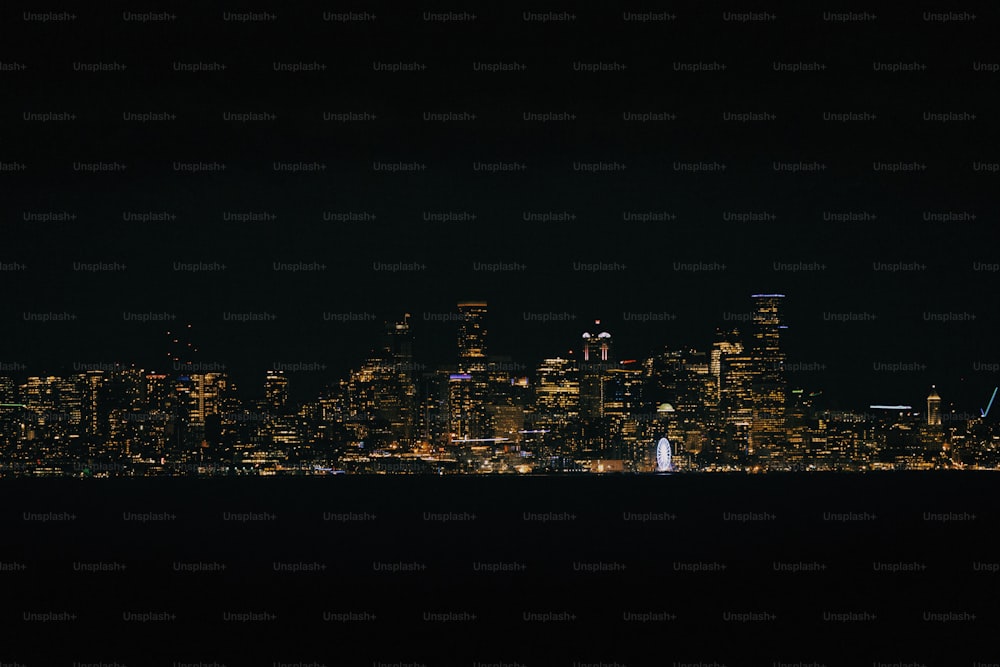 a view of a city at night from across the water