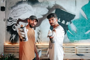 two men are pointing their guns at the camera
