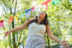 a woman with her arms outstretched in the air