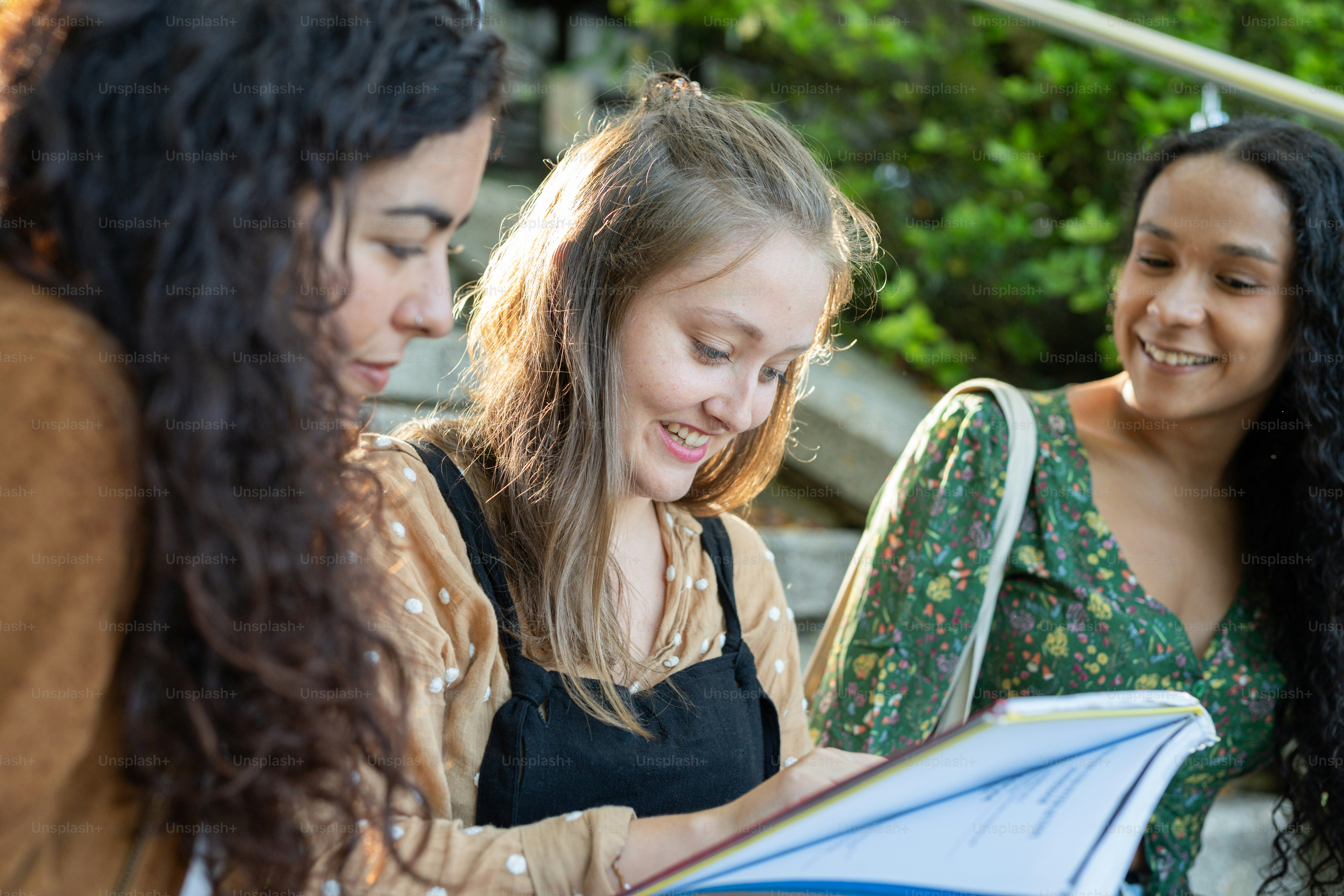 a group of young women sitting next to each other