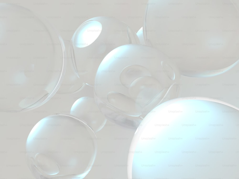 a group of bubbles floating on top of a white surface