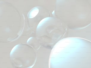 un groupe de bulles flottant au-dessus d’une surface blanche