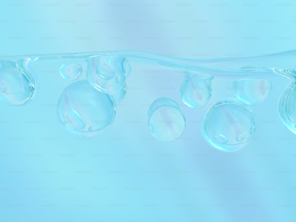 a group of bubbles floating on top of a blue surface