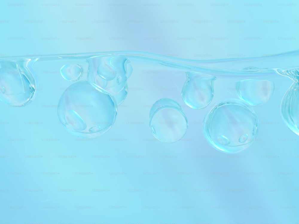 um grupo de bolhas flutuando em cima de uma superfície azul