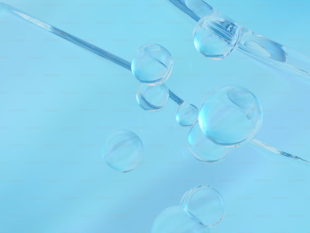 un groupe de bulles flottant au-dessus d’une surface bleue