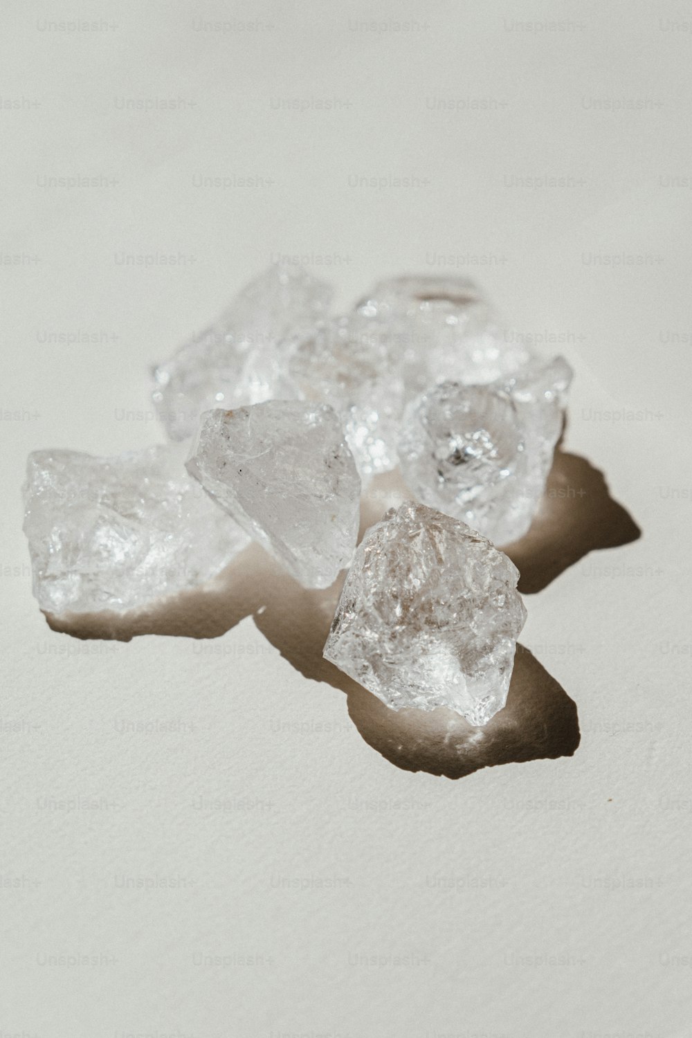 three pieces of ice sitting on top of a table