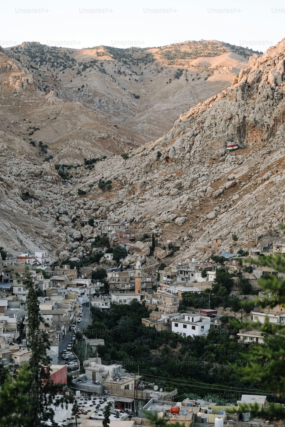 a view of a small town in the mountains