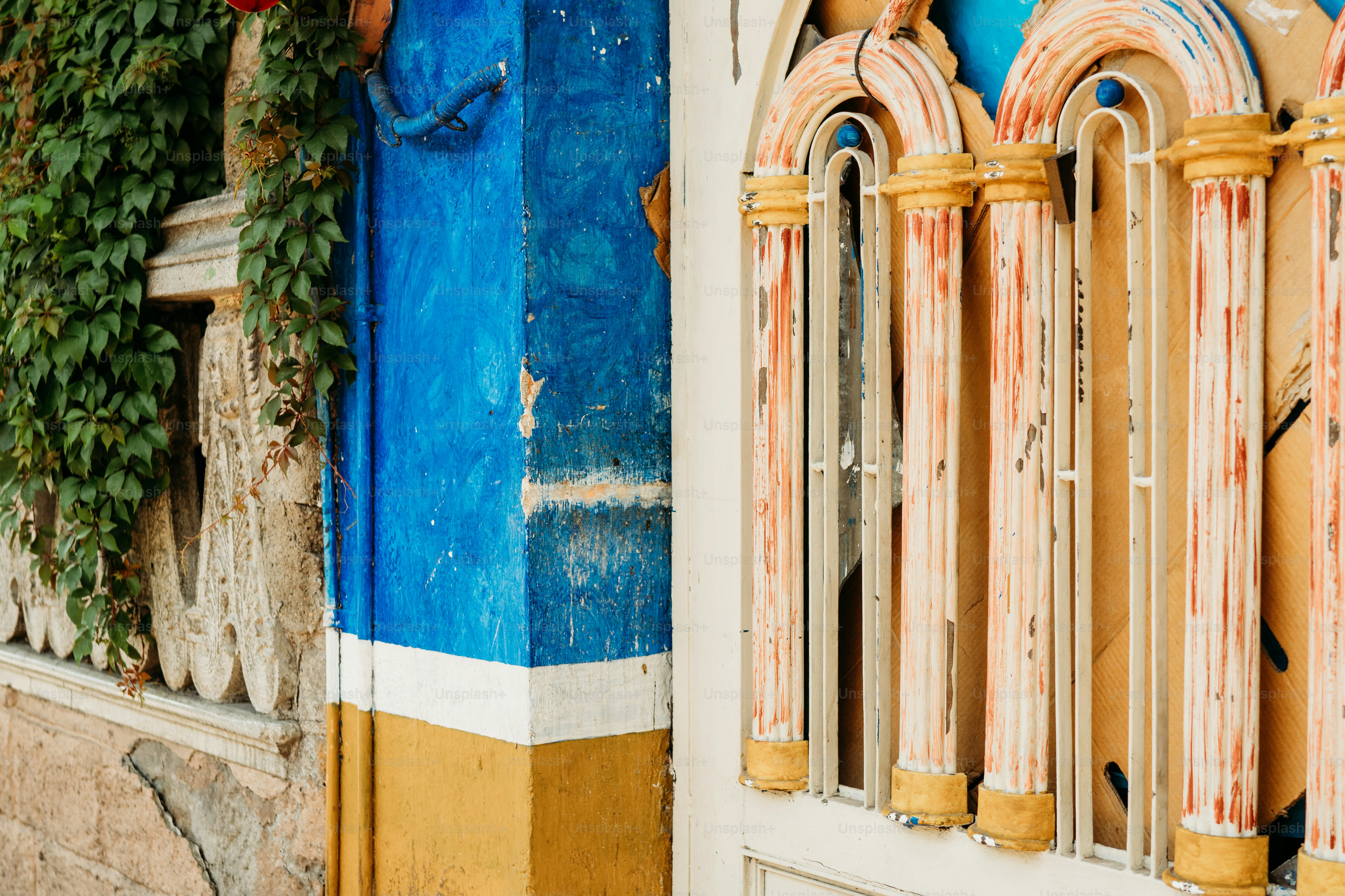 a blue and yellow building with a window
