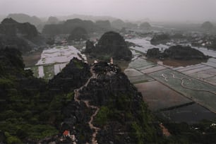 an aerial view of a small village on top of a mountain