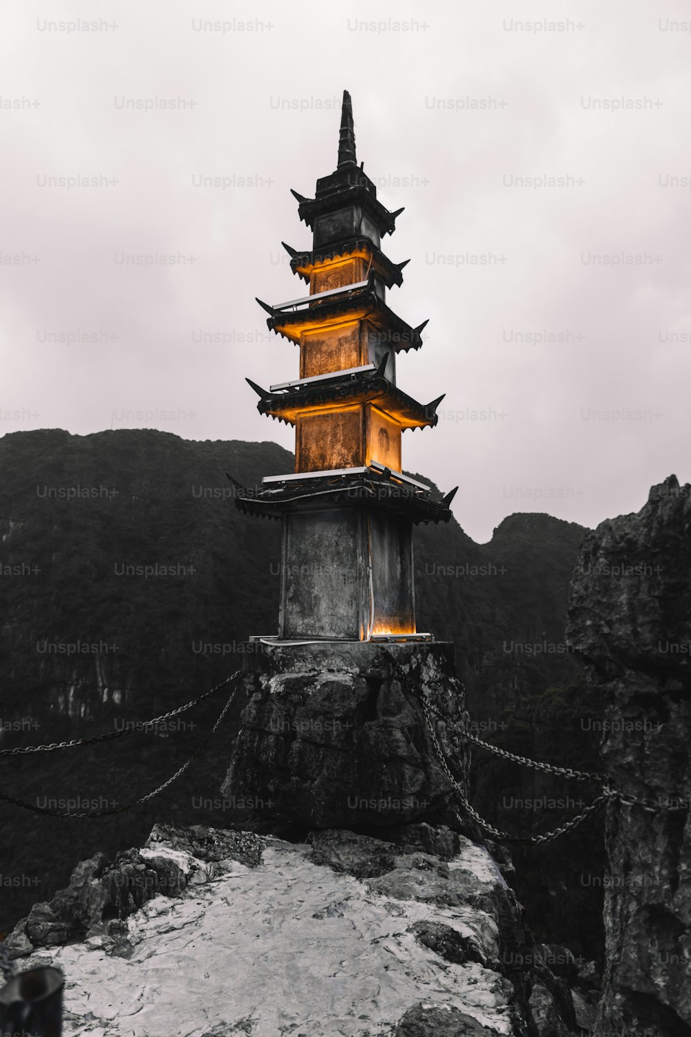 a tall tower sitting on top of a mountain