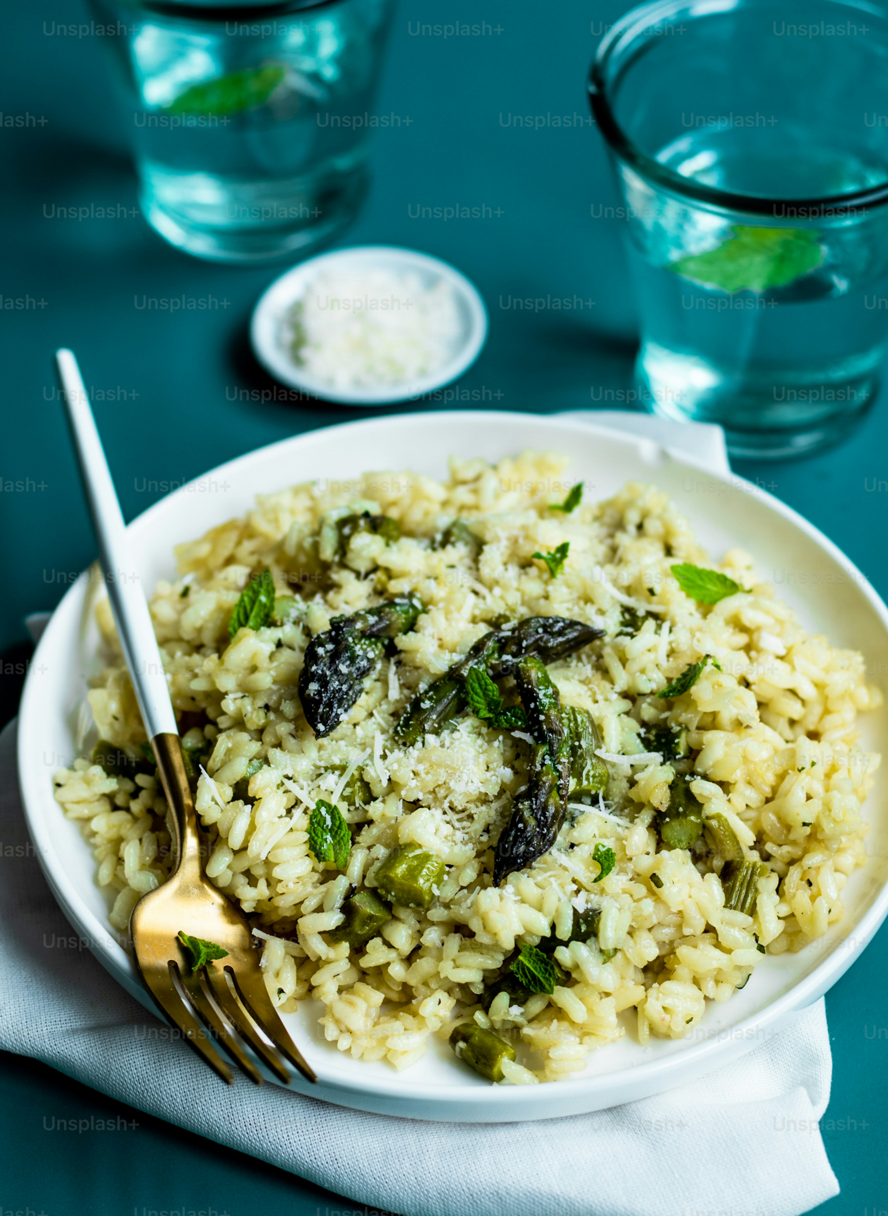 a white plate topped with rice and vegetables