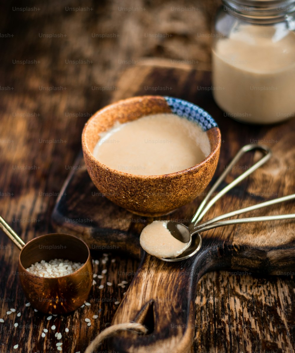 tahini sauce in a bowl, vegan, spoons