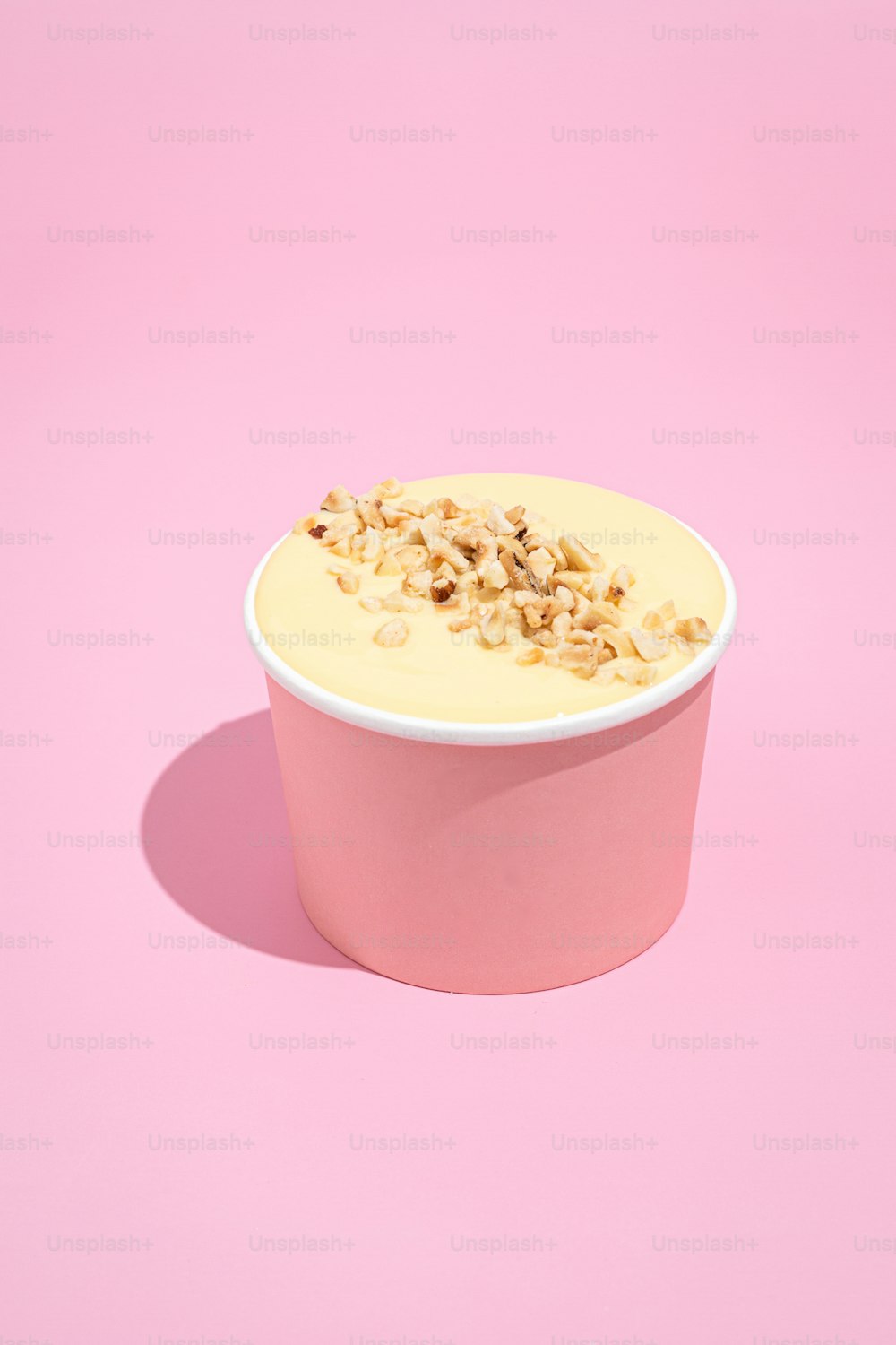 a bowl of cereal on a pink background