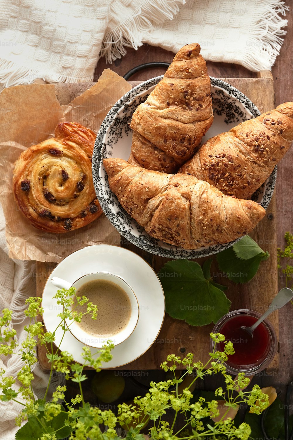 a table topped with pastries and a cup of coffee