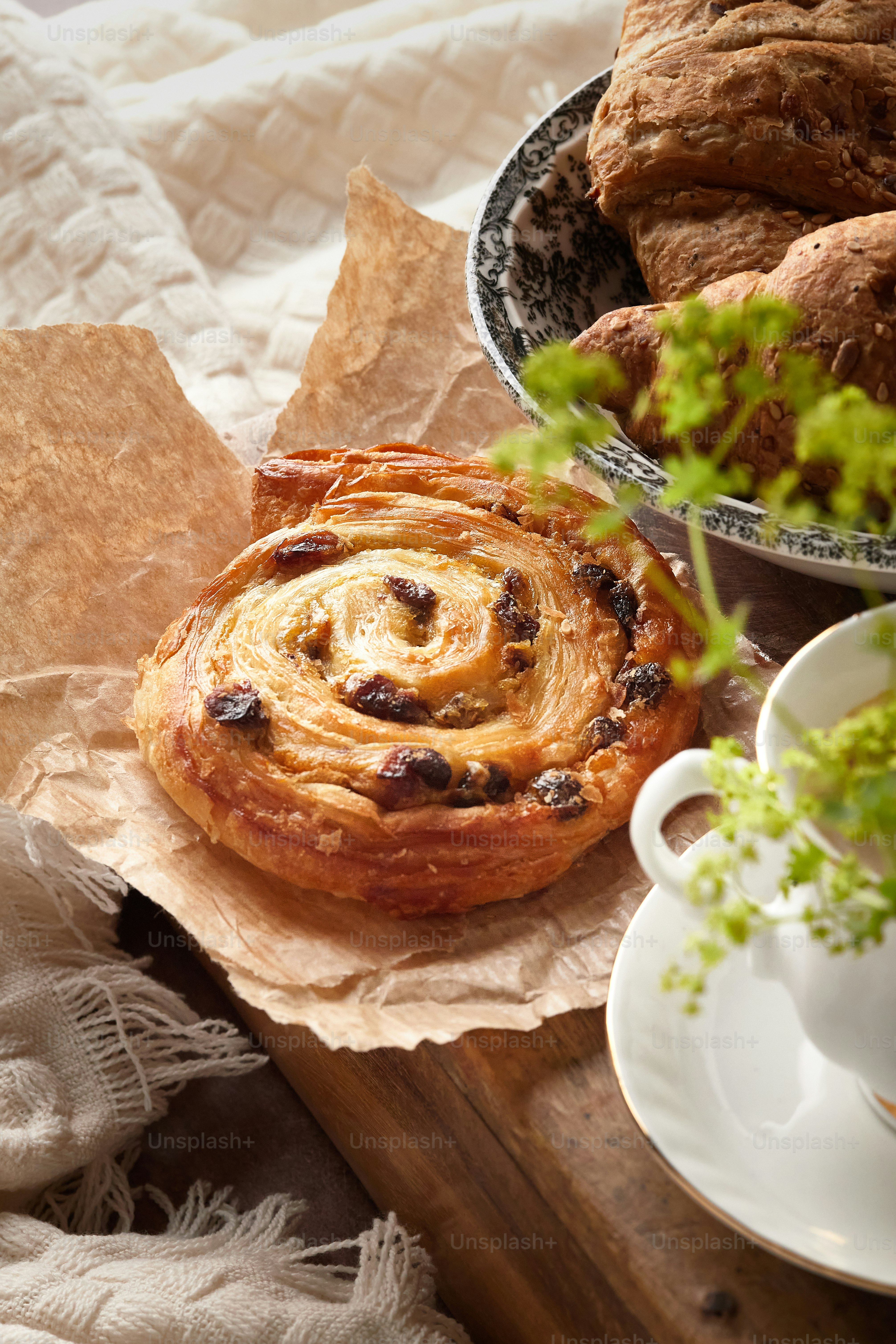 a table topped with pastries and a cup of coffee