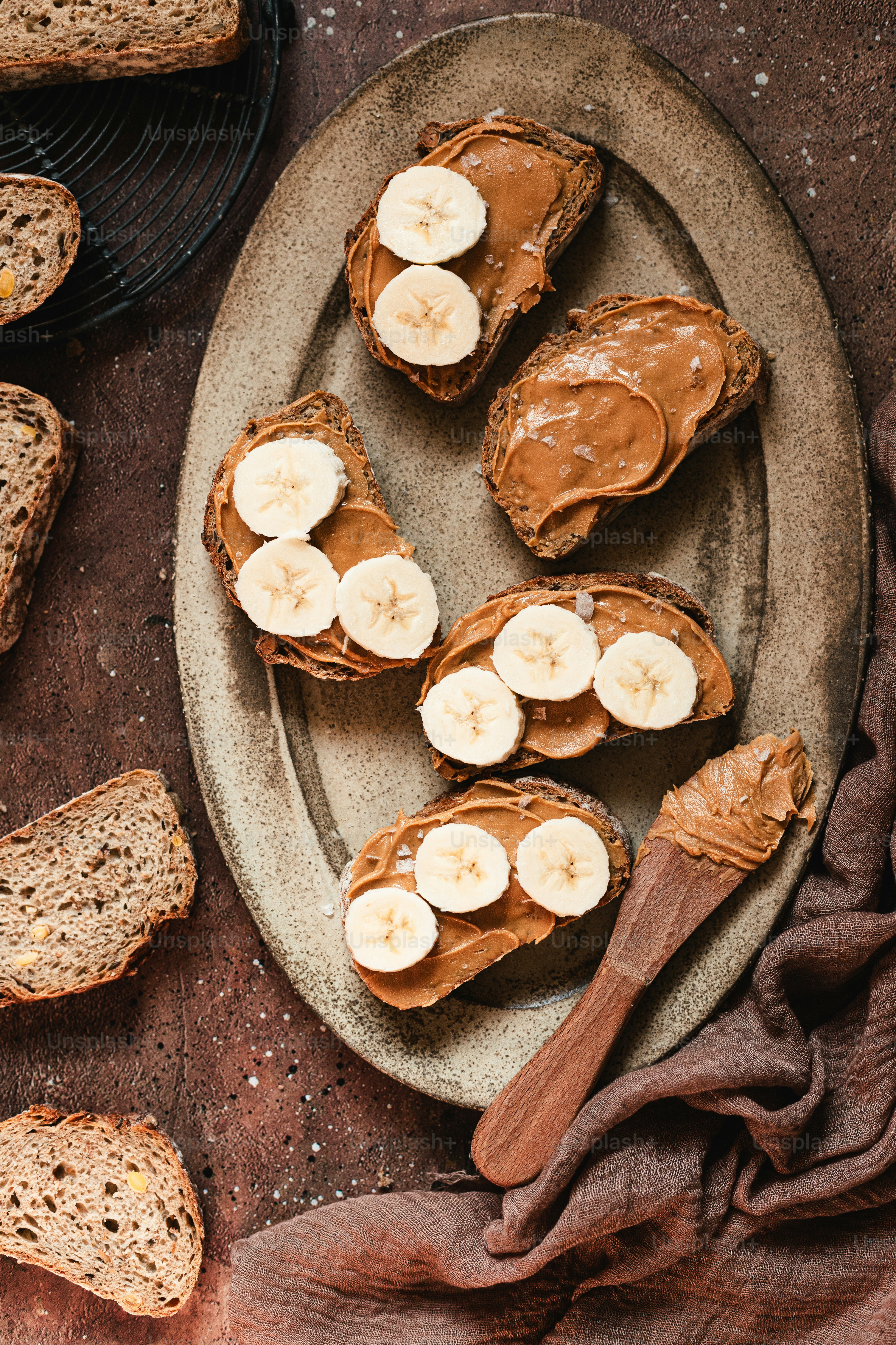 a plate of peanut butter and banana slices