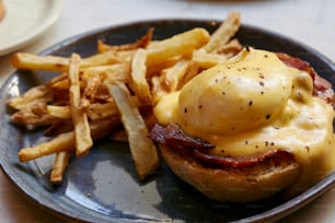 a plate with a sandwich and french fries on it