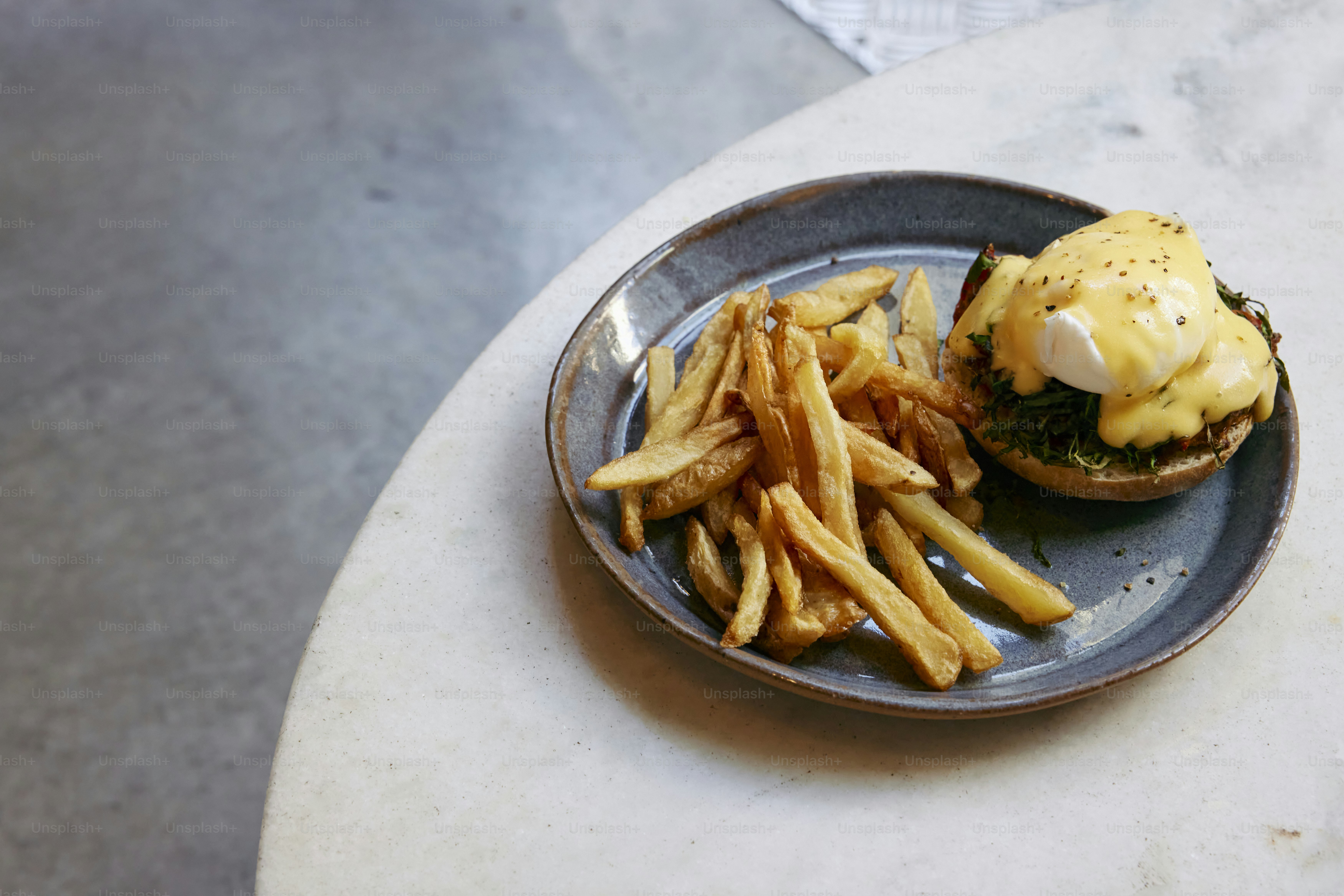 a plate with a burger and fries on it