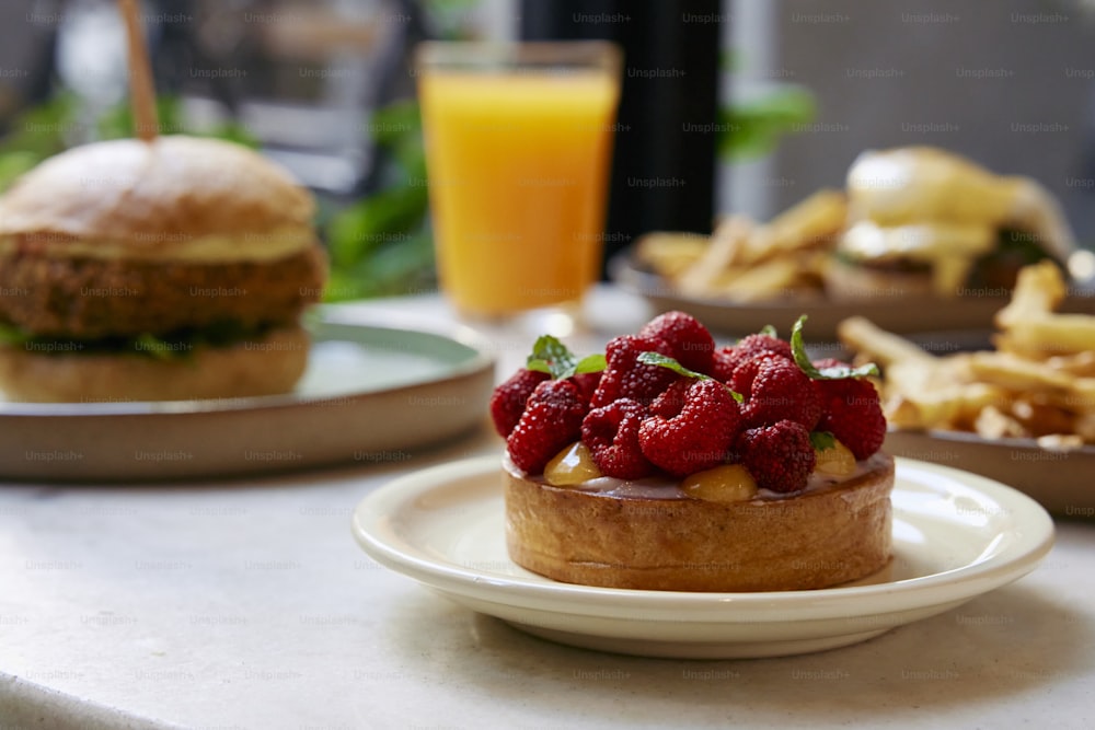 a table topped with plates of food and a sandwich