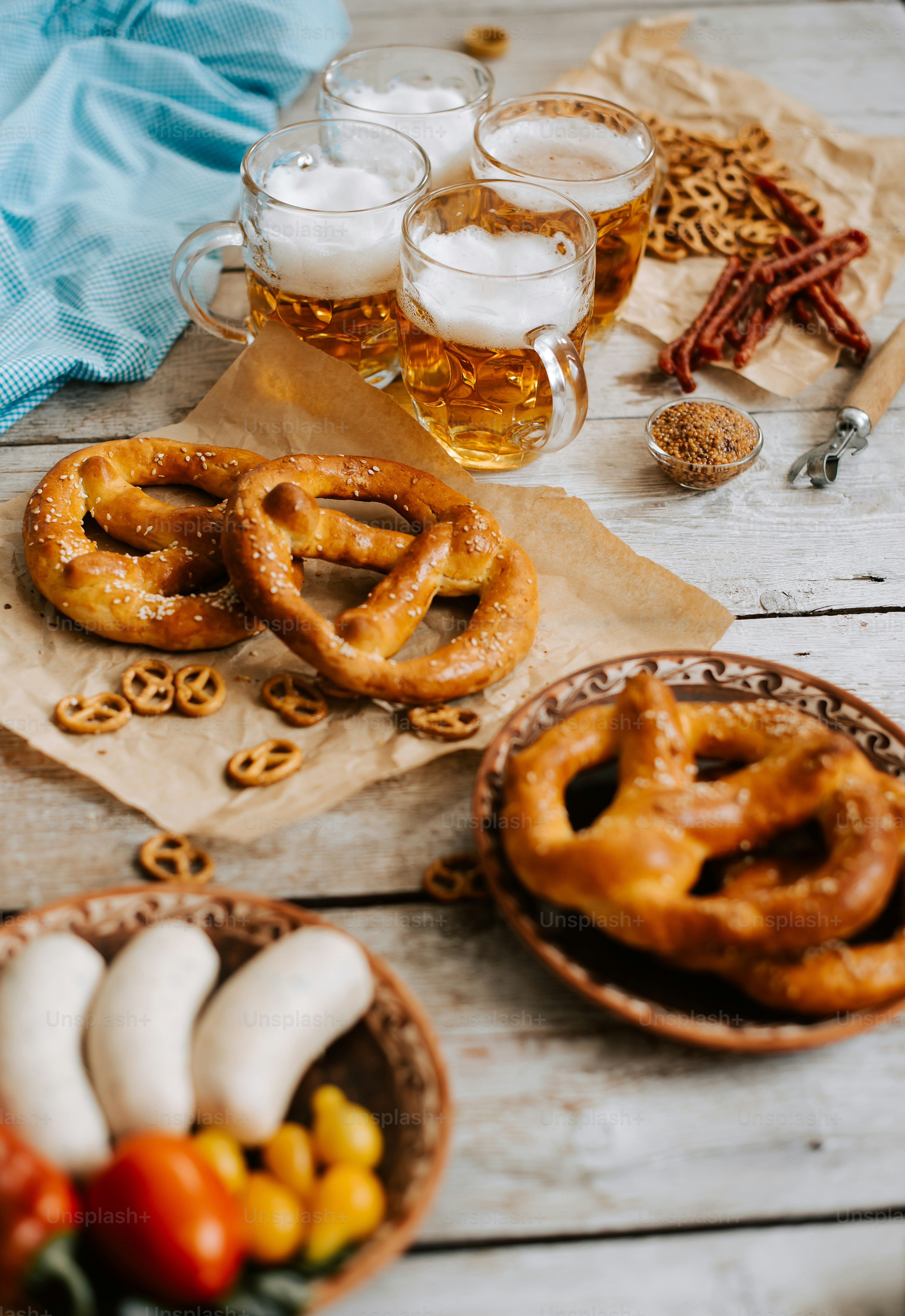 a table topped with pretzels and other foods