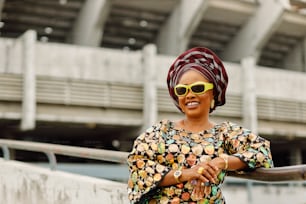 a woman wearing a headscarf and sunglasses