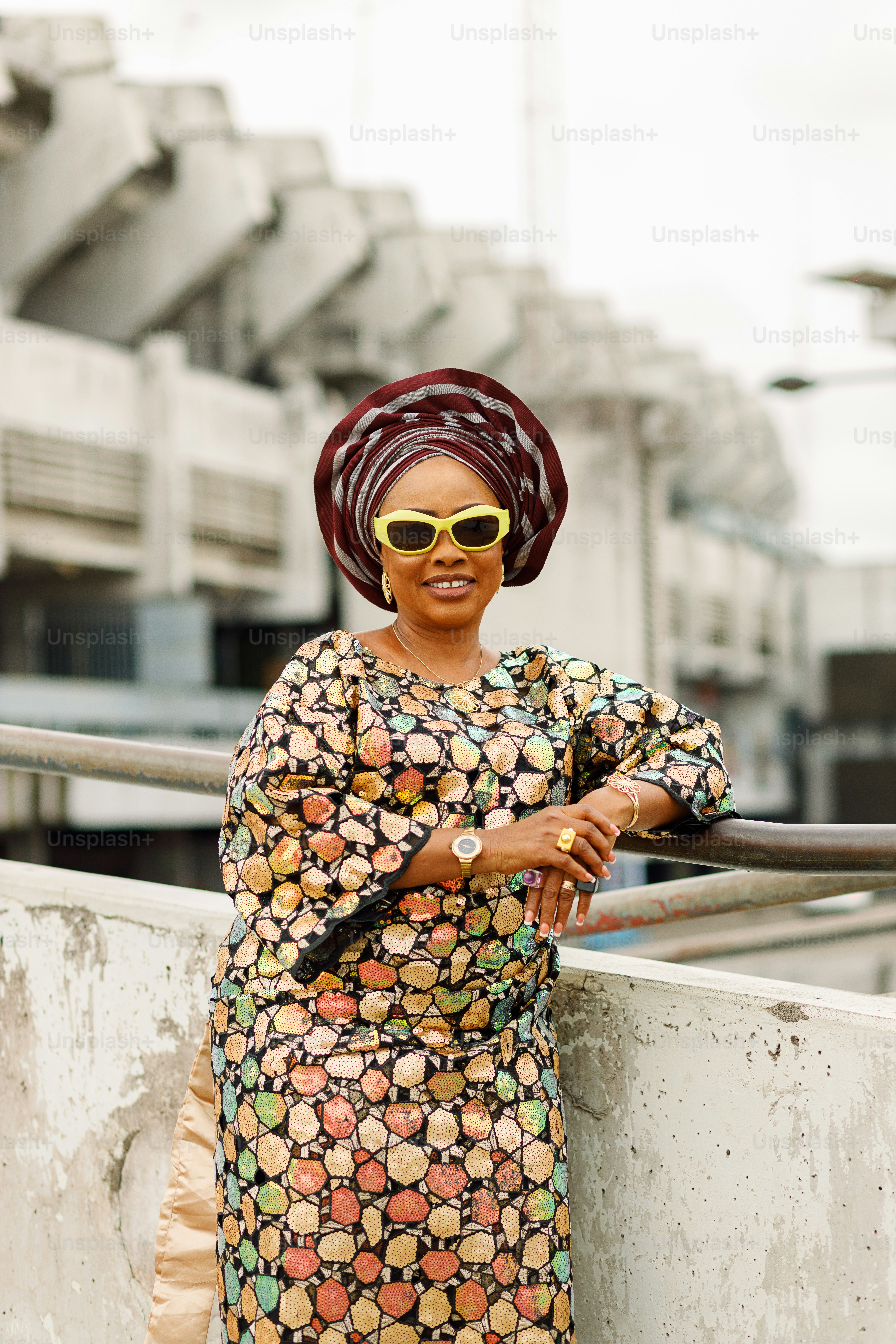 a woman wearing a colorful dress and a head scarf