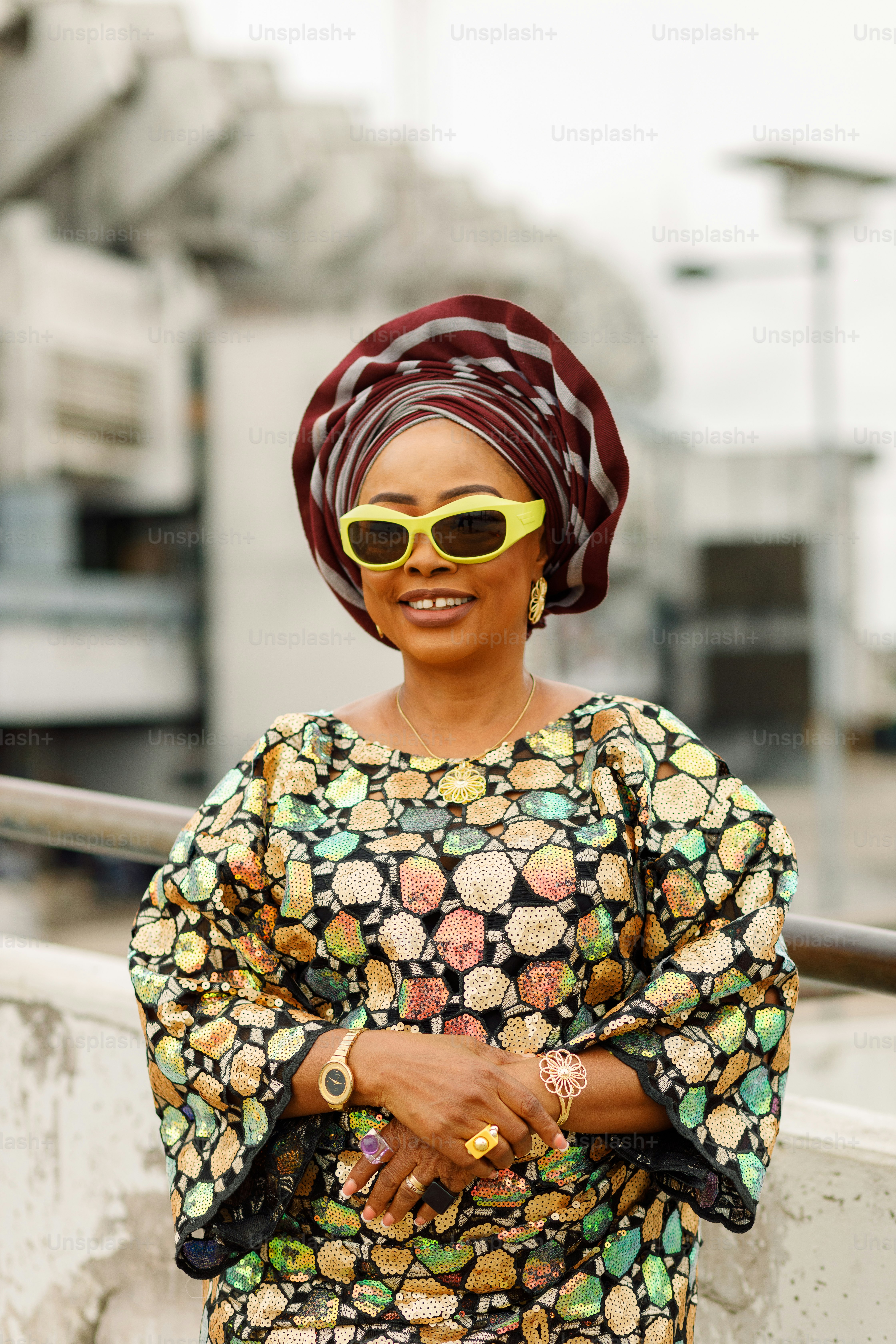 a woman wearing sunglasses and a head scarf